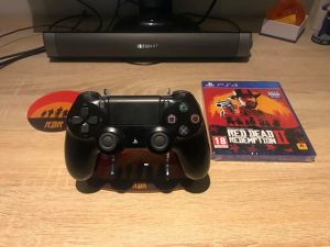 Red Dead Redemption 2 PS4 stand, coaster and game. Competition prize.